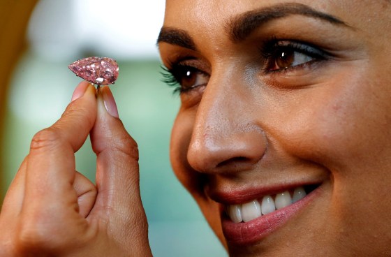 Image: A model poses with the \"Unique Pink\" at Sotheby's auction house in Geneva