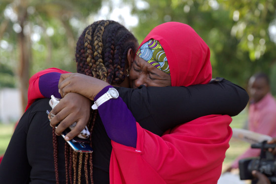 Image: Members of the #BringBackOurGirls campaign embrace each other at a sit-out in Abuja, Nigeria