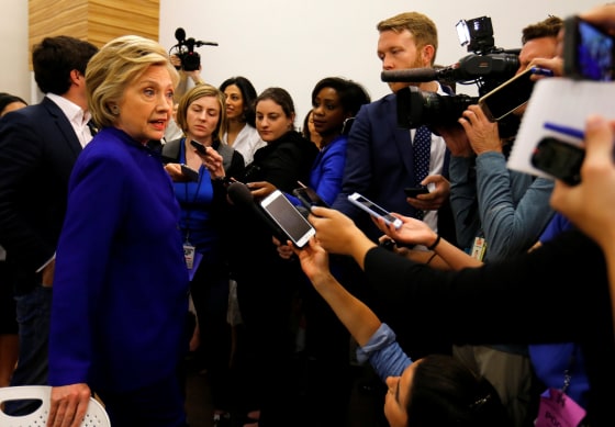 Image: U.S. Democratic presidential candidate Hillary Clinton stops to talk and take questions from the media during a campaign stop at a community center in Compton, California