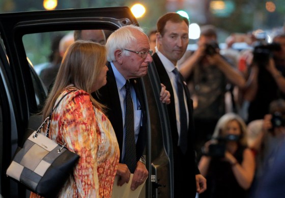Image: Democratic U.S. presidential candidate Bernie Sanders and his wife arrive for a meeting with Democratic U.S. presidential candidate Hillary Clinton at a hotel in Washington.
