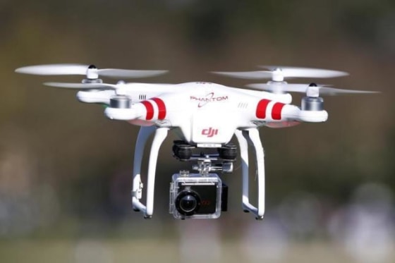 A Phantom drone by DJI company, equipped with a camera, flies during the 4th Intergalactic Meeting of Phantom's Pilots in an open secure area in the Bois de Boulogne, western Paris