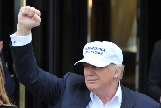 Image: Trump gestures as he arrives at his Turnberry golf course, in Turnberry, Scotland