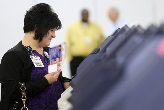 Image: An Ohio voter casts her ballot on Super Tuesday in Ohio