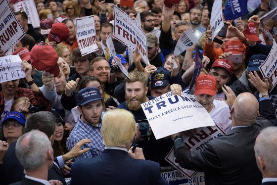 Image: Donald Trump signs autographs during a rally in Cleveland