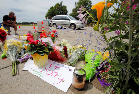 Image: Man kneels at shooting site of Philando Castile in Minnesota