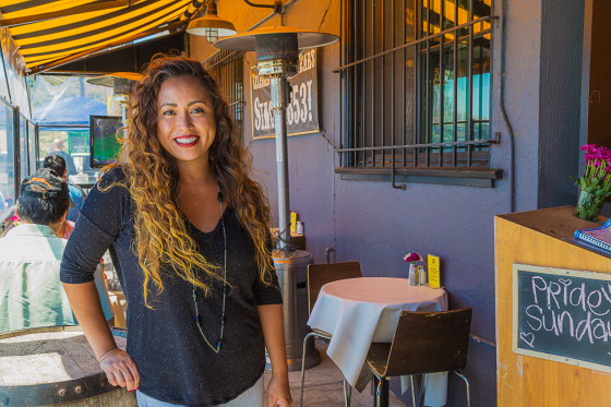 Vanessa Garcia poses for a picture outside of her 7 Mile House restaurant.