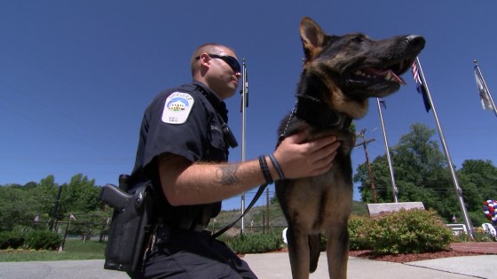 Rocky Mount Police Officer Chris Shelton with his K-9 partner and former Throw Away Dogs participant, Rousey