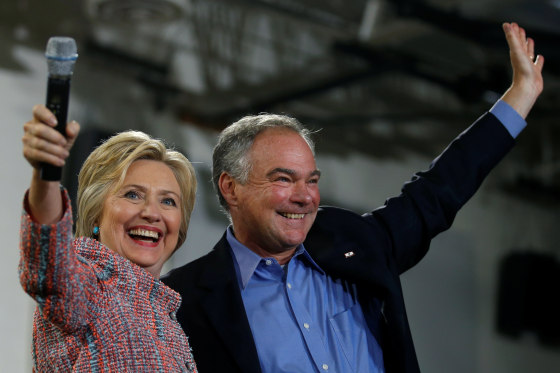 Image: Democratic U.S. presidential candidate Hillary Clinton and U.S. Senator Tim Kaine (D-VA) wave to the crowd during a campaign rally at Ernst Community Cultural Center in Annandale