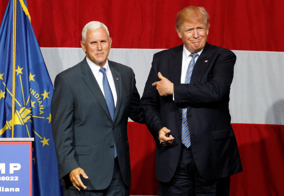 Image: Republican presidential candidate Donald Trump and Indiana Governor Mike Pence wave to the crowd before addressing the crowd during a campaign stop at the Grand Park Events Center in Westfield