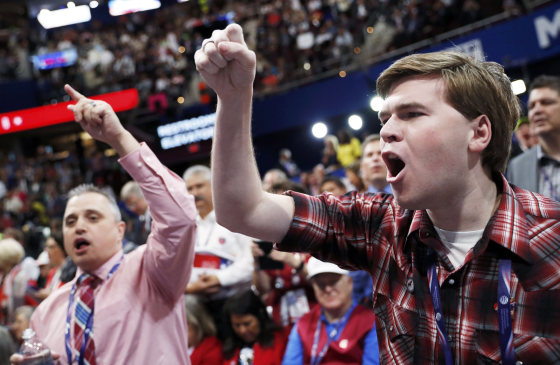 Image: Convention delegates yell and scream as the Republican National Convention descended into chaos over the announcement that the convention would not hold a roll-call vote in Cleveland
