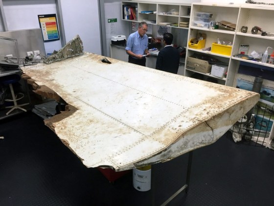 Image: Investigators examine the Pemba Island debris in this handout picture released by the ATSB.
