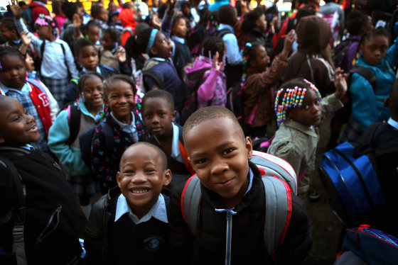 Students at Frazier International Magnet School wait outside before the start of school on September 19, 2012 in Chicago, Illinois.