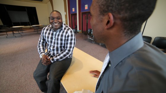 Image: Quinton Thomas, left, and his attorney Blake Strode.