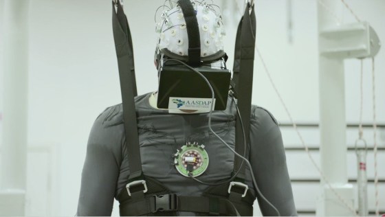 Patient using brain-machine interface (BMI) to train in regaining some movement in legs.