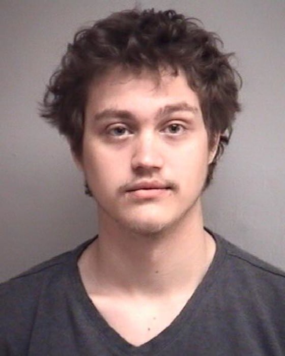 This photo released by the Joplin Police Department Saturday shows Tom S. Mourning II, 26, arrested in connection with a shooting spree that injured several people in Joplin, Missouri, Saturday morning.