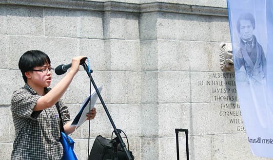 Lydia X. Z. Brown participating in the annual communal reading of Frederick Douglass' "What To The Slave Is The Fourth of July?" at the Boston Common, July 2015.