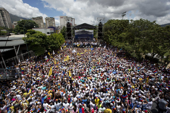 Demonstrators take part in the \"taking of Caracas\" march in Caracas, Venezuela, Thursday, Sept. 1, 2016.
