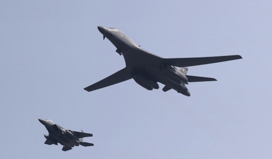 Image: U.S. B-1B bomber, right, flies over Osan Air Base with South Korean Air Forces jet in Pyeongtaek, South Korea
