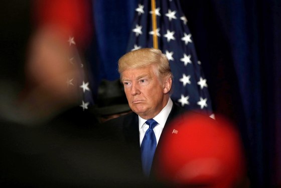 Image: Republican presidential nominee Donald Trump reacts as reporters yell questions to him after he stated that he believes U.S. President Barack Obama was born in the United States in Washington