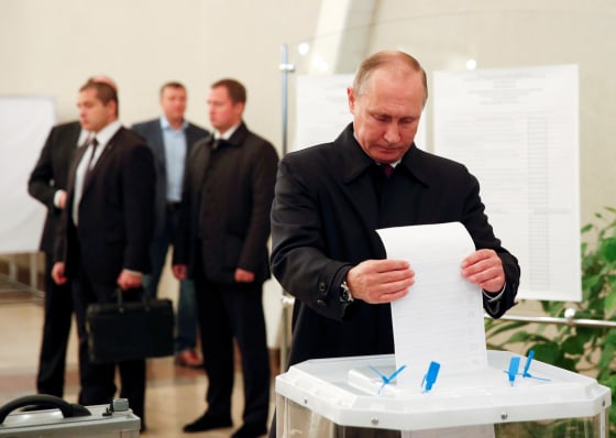 Image: Russian President Putin visits polling station during parliamentary election in Moscow