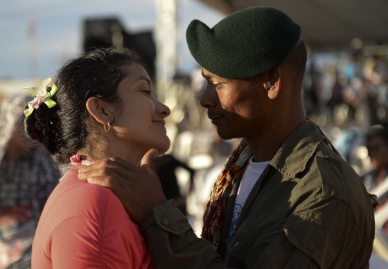 Members of the Colombian Revolutionary Armed Forces of Colombia (FARC) guerrilla attend the broadcasting of the signing of the peace accord