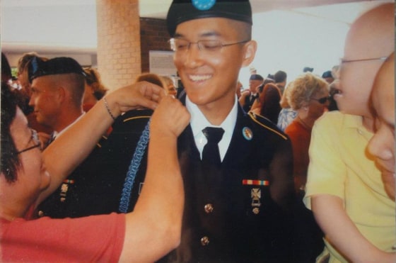 Danny Chen's mother, Su Zhen Chen, fixing his cord in Fort Benning, Georgia, in April 2011.