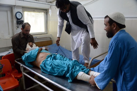 Image: An injured Afghan man receives treatment