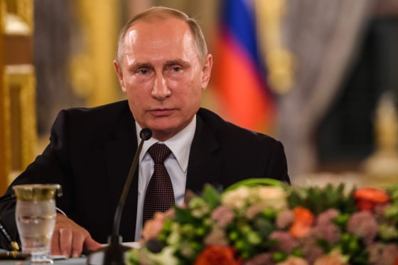 Image: TRussia's Vladimir Putin takes part in a news conference Monday.