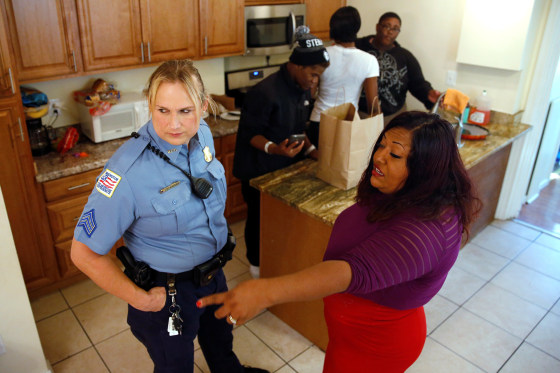 Image: Hawkins speaks with Corado at a home where she shelters transgender women of color in Washington