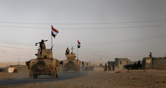 Image: Iraqi army gather after the liberation of Khalidiya village from Islamic State militants, south of Mosul, during an operation to attack Islamic State militants in Mosul