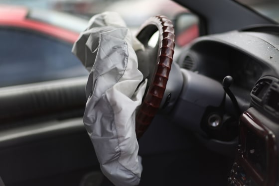 Image: A deployed airbag is seen in a Chrysler vehicle