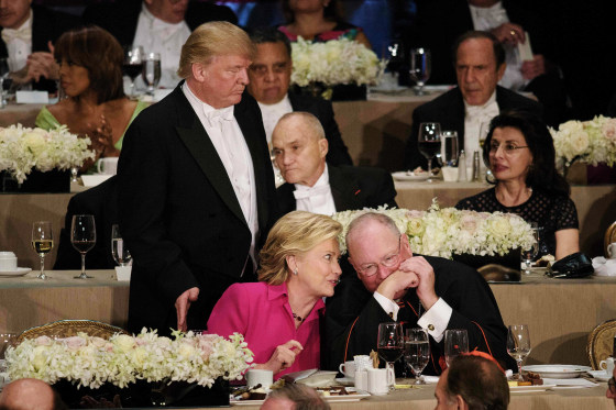 Image: Trump pats Clinton on the back at the Al Smith dinner