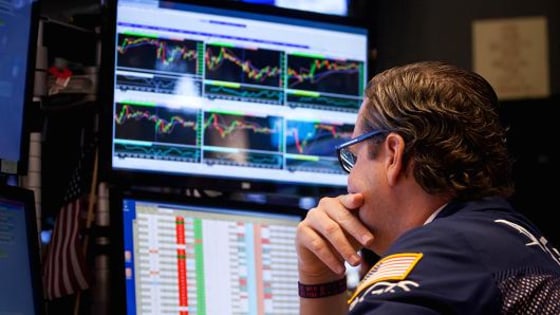 A trader works on the floor of the New York Stock Exchange (NYSE) in New York.