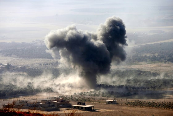 Image: Smoke rises at Islamic State militants' positions in the town of Naweran