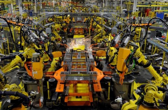 Robotic arms spot welds on the chassis of a Ford Transit Van under assembly at the Ford Claycomo Assembly Plant in Claycomo