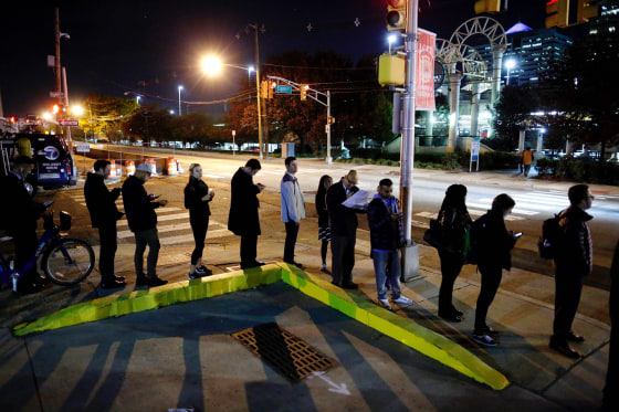 Image: People wait in line to vote during the presidential election