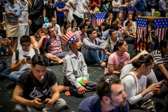 Image: People watch live election results