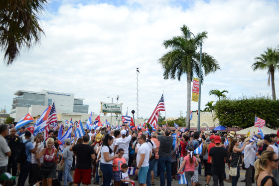 Cuban Americans gather in front of Versailles Restaurant in Miami following news of Fidel Castro's death.