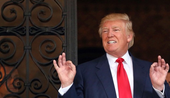 Image: U.S. President-elect Donald Trump talks with the media at Mar-a-Lago estate where Trump attends meetings, in Palm Beach, Florida