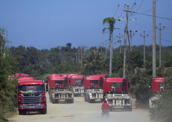 New government cargo trucks used to transport imported food wait outside the entrance of the Laramar warehouse in Puerto Cabello, Venezuela