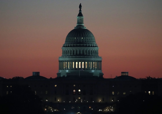 The early morning sun begins to rise behind the U.S. Capitol in Washington, on Nov. 17, 2016.