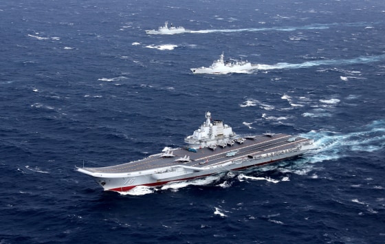 Image: FILE PHOTO: China's Liaoning aircraft carrier with accompanying fleet conducts a drill in an area of South China Sea