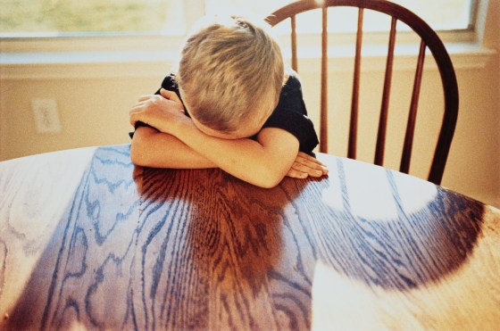 Boy with Head on Table