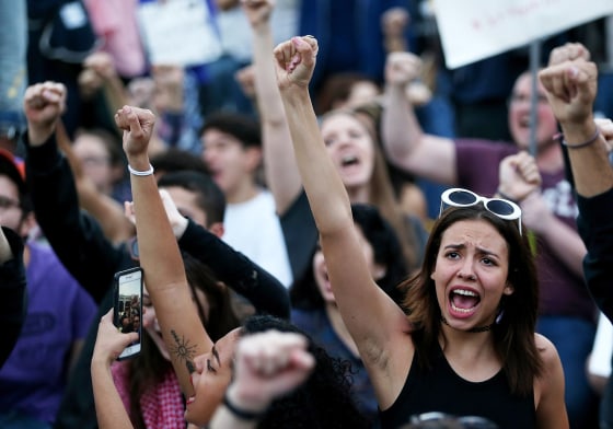 Image: Protesters chant as they block a road during a demonstration against the immigration ban imposed by President Trump at Los Angeles International Airport on Jan. 29.