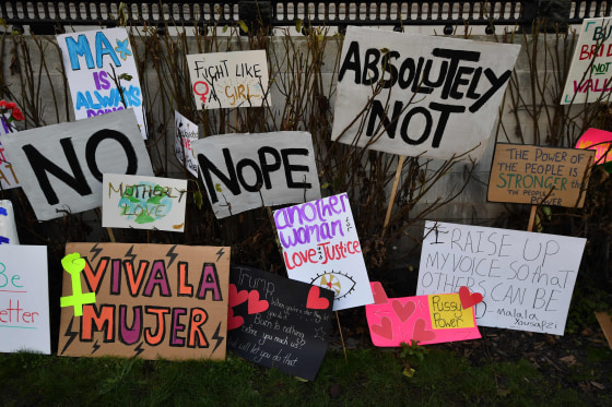 Image: Placards are left discarded in the garden of the National Gallery at the end of the Women's March in London on Jan. 21, 2017.