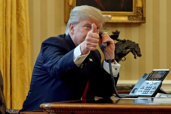 Image: File photo of U.S. President Trump giving a thumbs-up to reporters as he waits to speak by phone with the Saudi Arabia's King Salman in the Oval Office at the White House in Washington