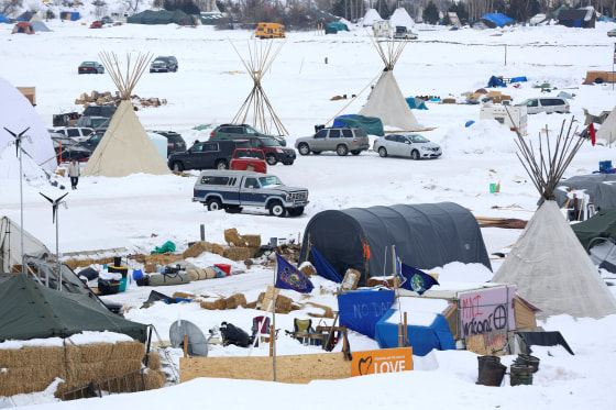 Image: Signs hang in the Dakota Access Pipeline protest camp on the edge of the Standing Rock Sioux Reservation near Cannon Ball, North Dakota on Jan. 24.