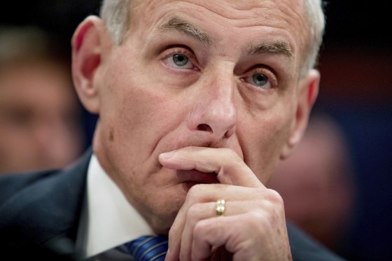 Image: John Kelly listens while testifying on Capitol Hill