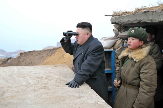Image: Kim Jong Un uses binoculars to look at South Korean territory from an observation post on Jangjae islet