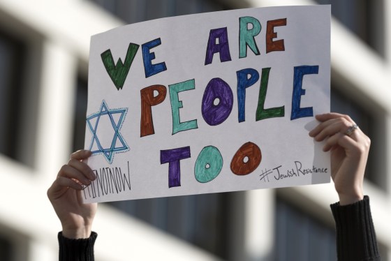 Image: Protester holds a sign during a demonstration in Beverly Hills, California, Dec. 4, 2016.